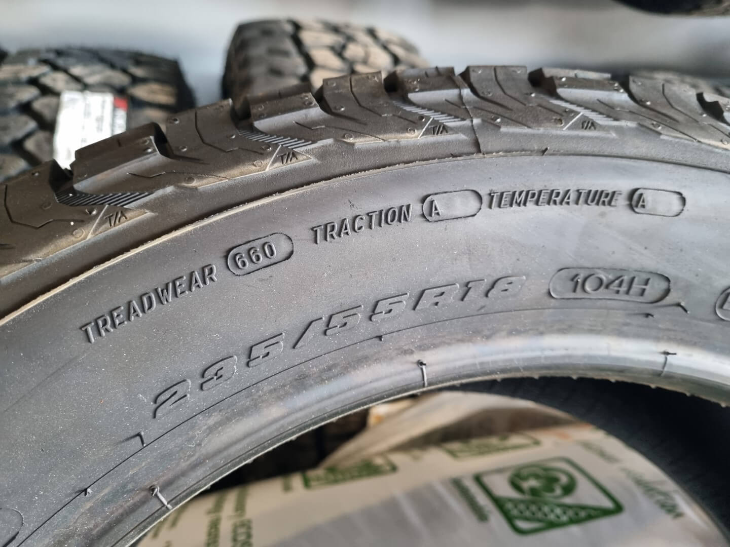 UTQG rating stamps on a tyre sidewall.