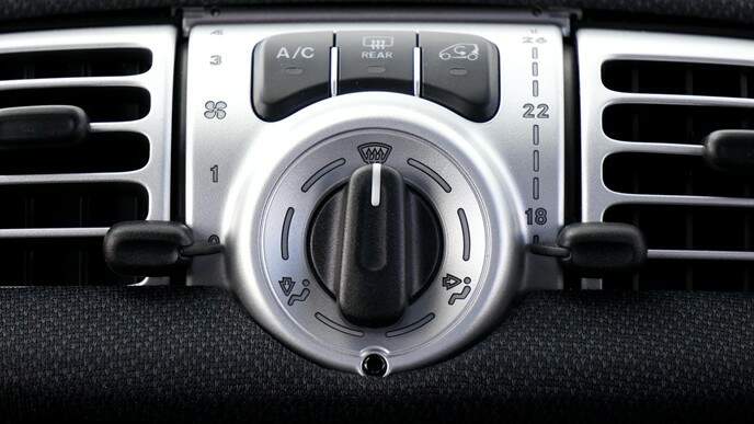 Reasons Why Your Car’s Air Conditioning Smells A close-up of a car’s air A/C settings