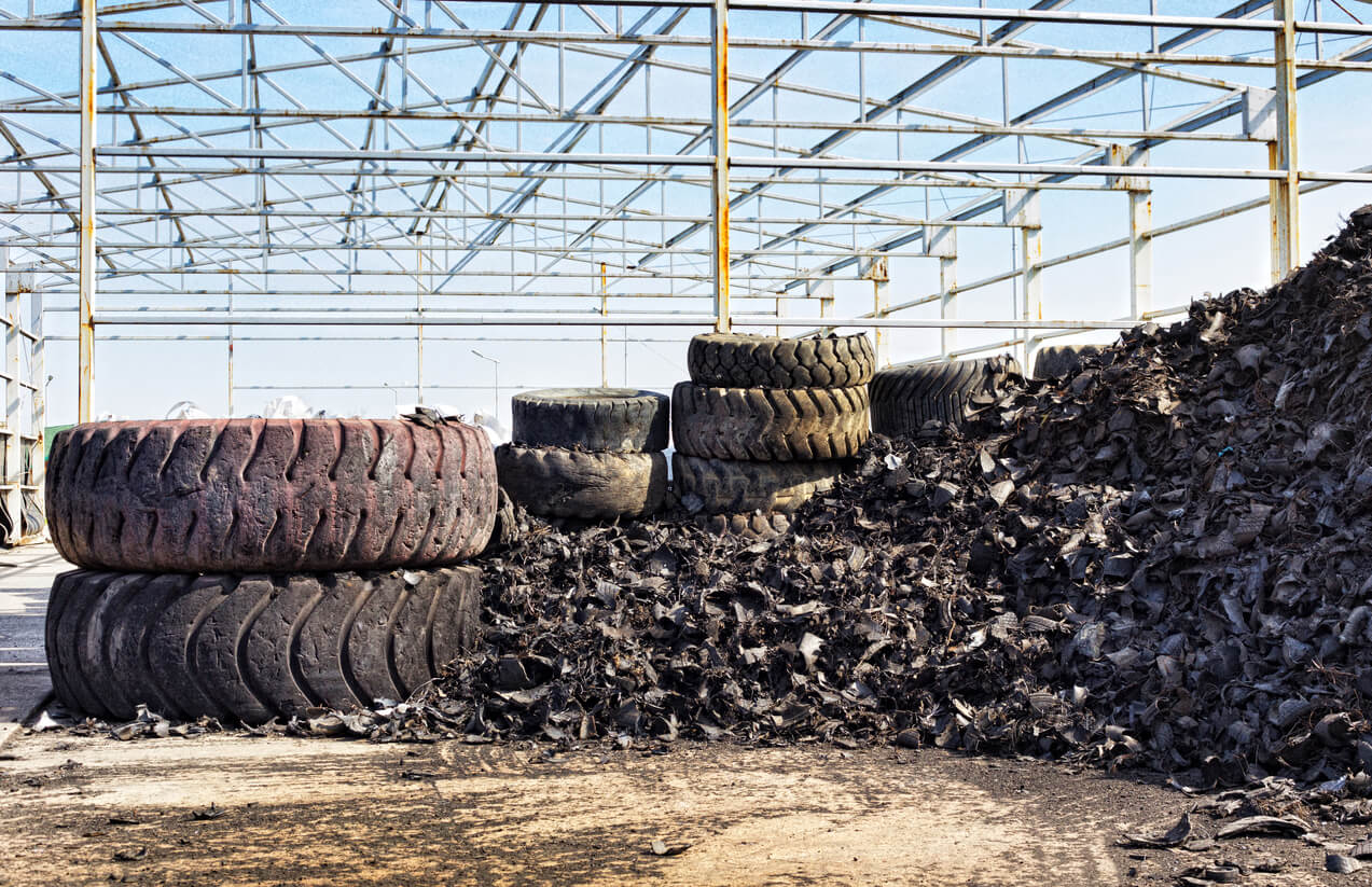 Large pile of shredded tyres, awaiting processing and sifting