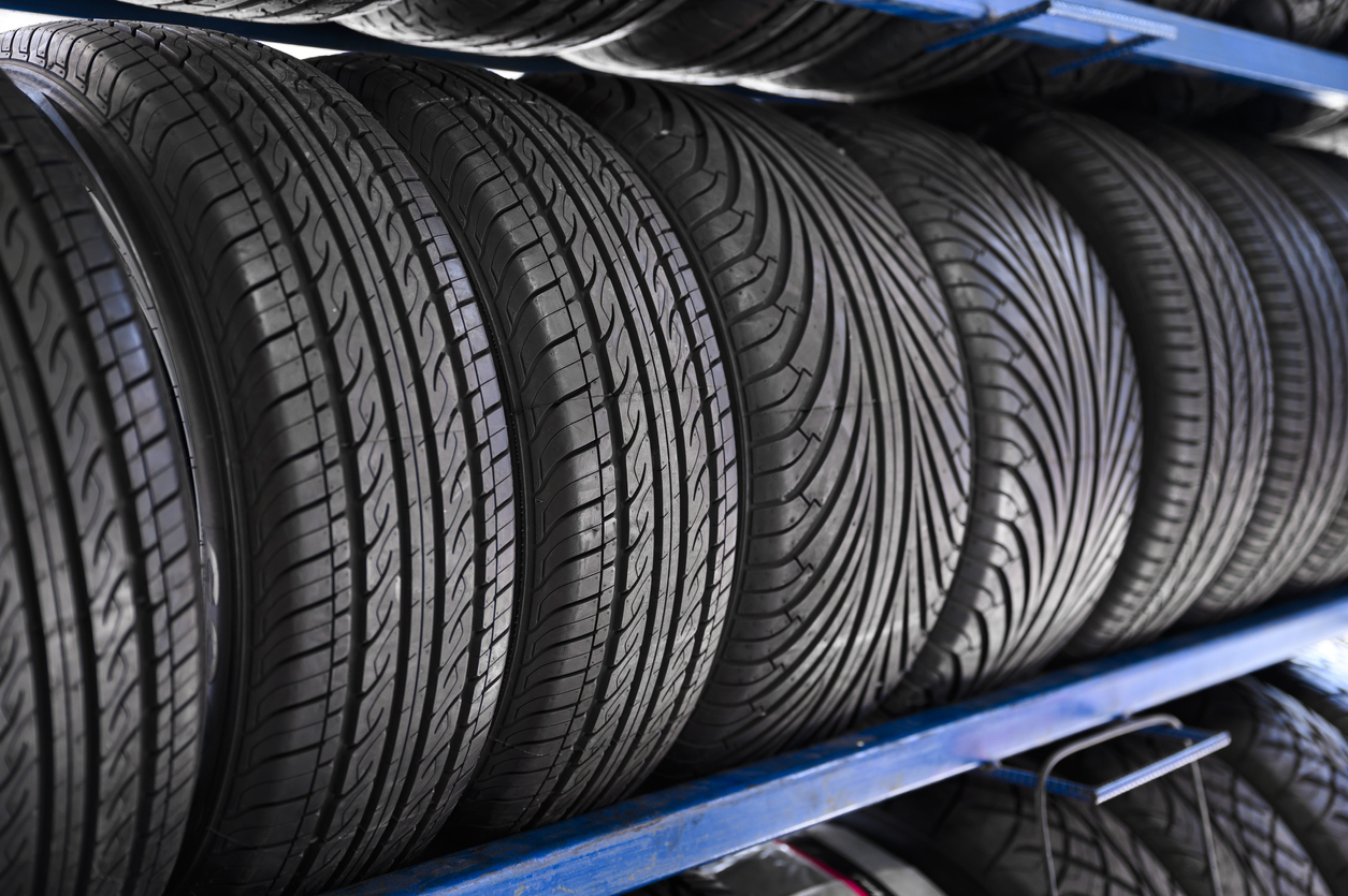 Multiple tyres on a tyre rack.