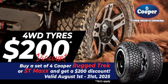 Close up of 4WD tyre going through mud with words '4WD Tyres $200 Discount'