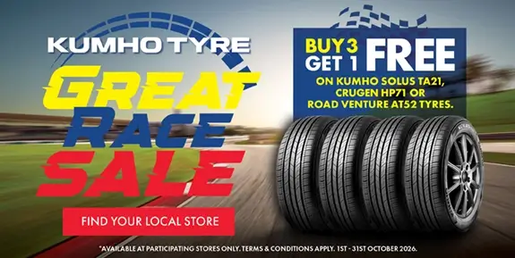 Tyres in middle of racetrack, buy 3 get 1 free text above them.