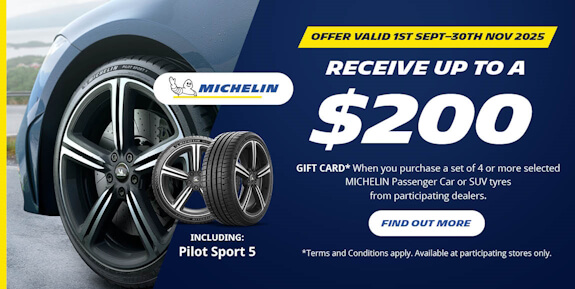 Slanted image of a car on the left, and text on the right saying up to $200 giftcard promotion.