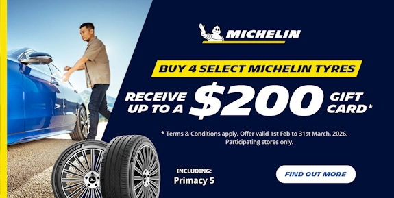 Promo for $200 gift card, with a man entering a blue luxury car and two Michelin brand tyres nearby