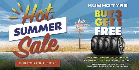 Beach with 4 tyres near it and words 'Hot summer sale buy 3 get 1 free' on select Kumho tyres