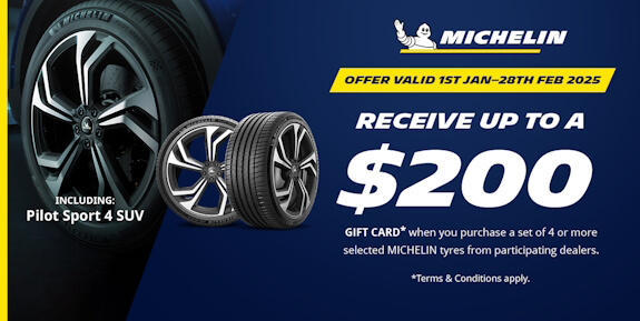 Angled tyre next to a blue banner, with text detailing a $200 gift card promotion when buying 4 or m